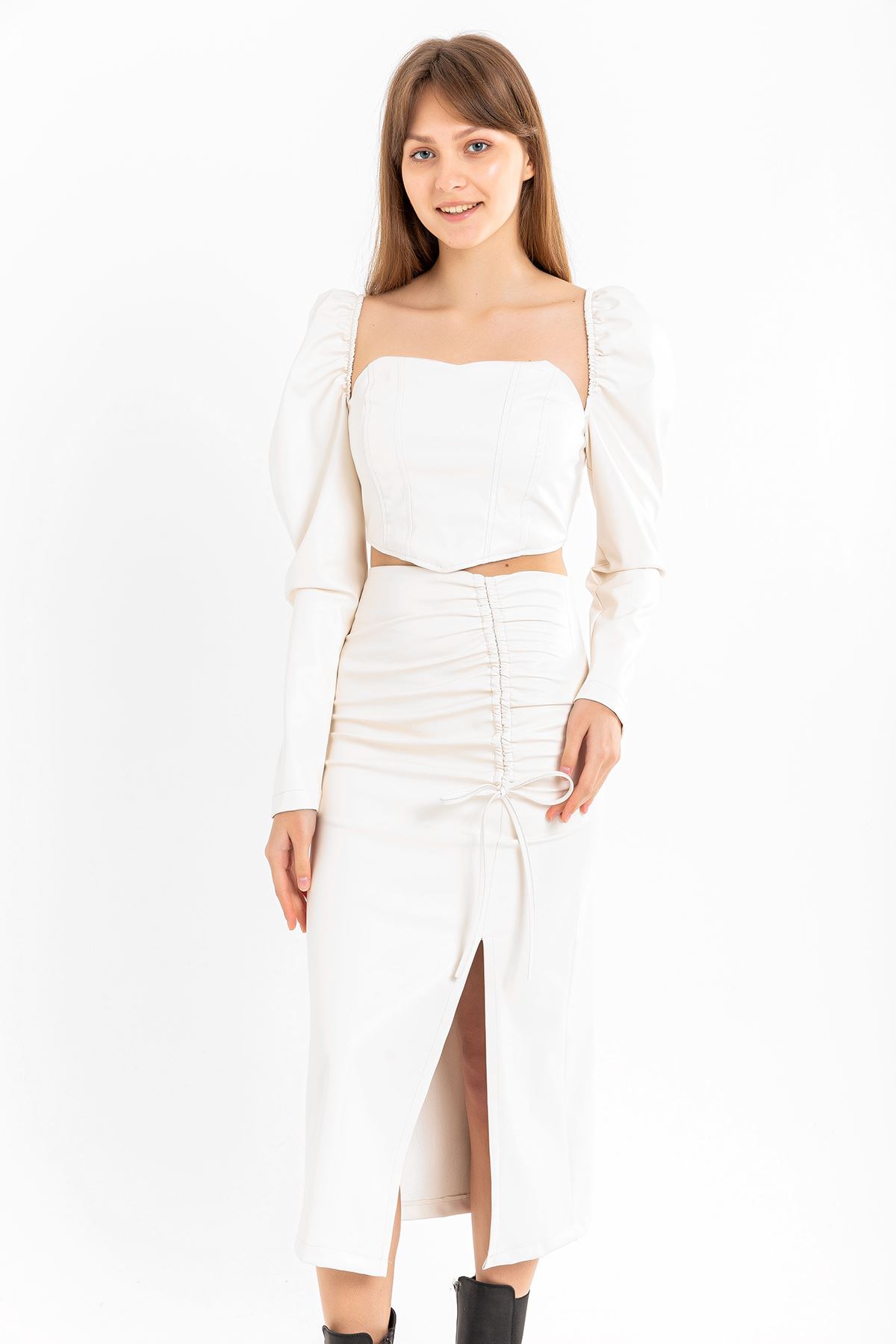 Picture of Deri Kumaş Diz Altı Boy Yırtmaçlı Büzgü Detaylı Kadın Etek-Ekru